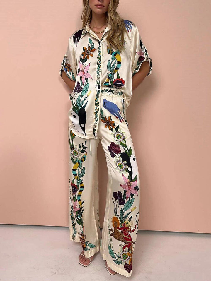 Nika | Completo camicia e pantaloni in satin con stampa unica, stile Resort