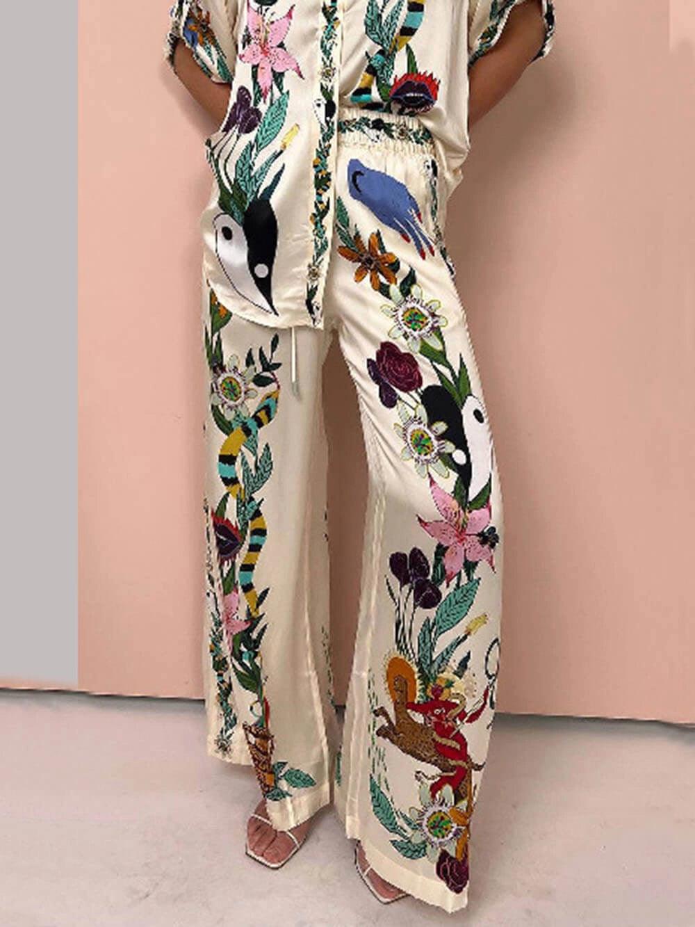 Nika | Completo camicia e pantaloni in satin con stampa unica, stile Resort